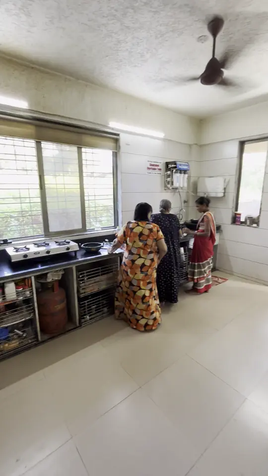 Two women at work in the bright, clean kitchen