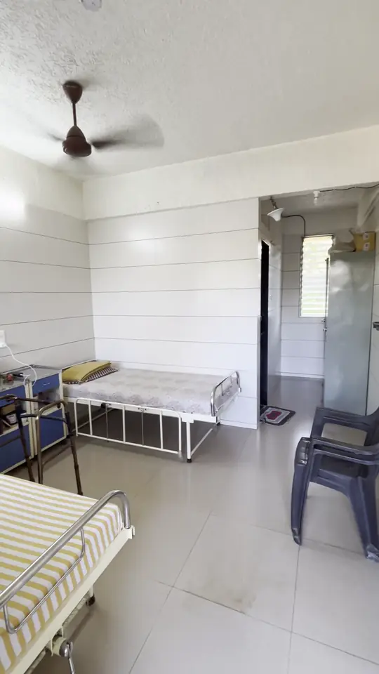 A bright, clean room with a bed, a ceiling fan and a window